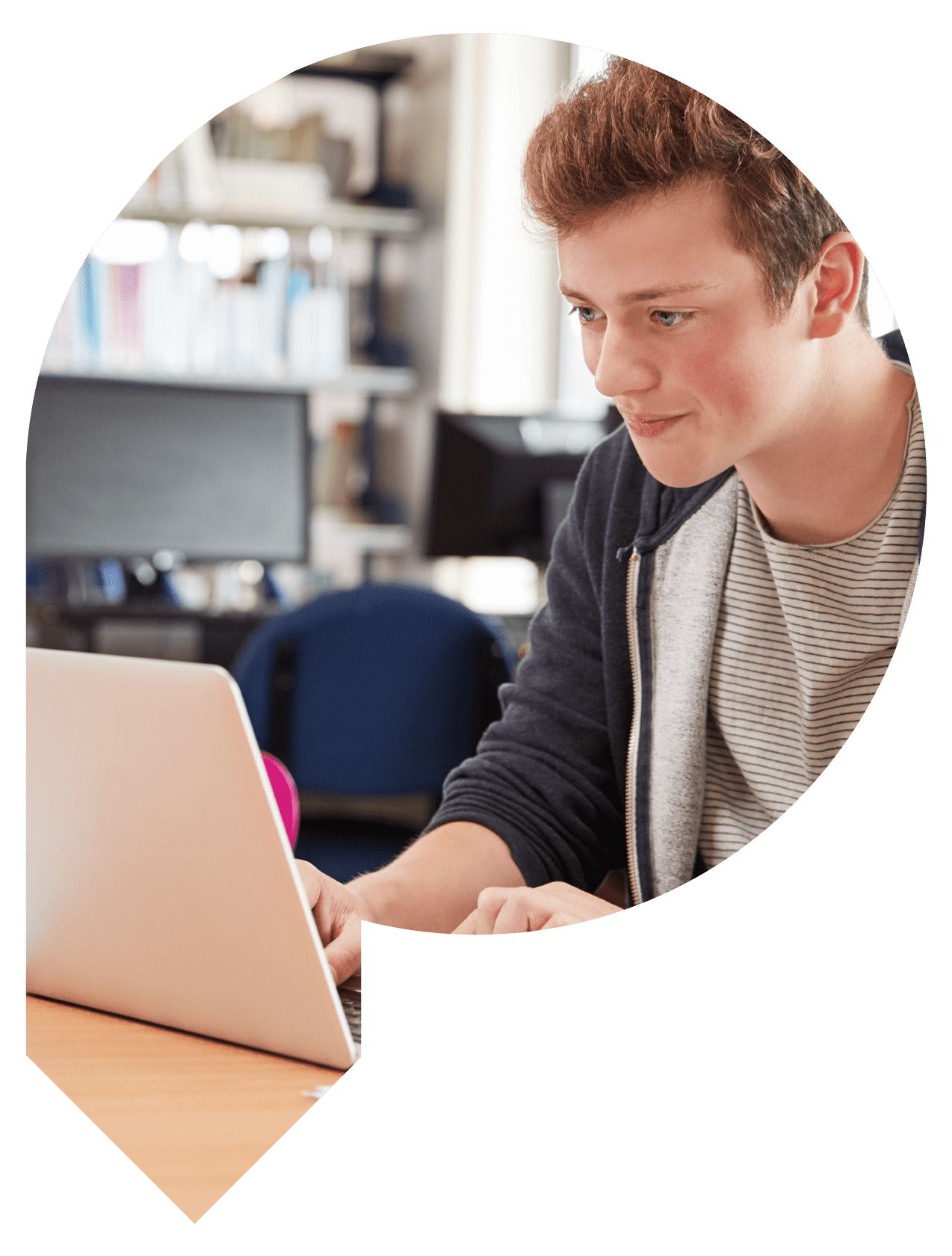 Student working on a laptop whilst smiling